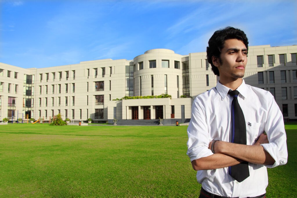 Campus marketing photography Auckland of senior student standing in front of school building