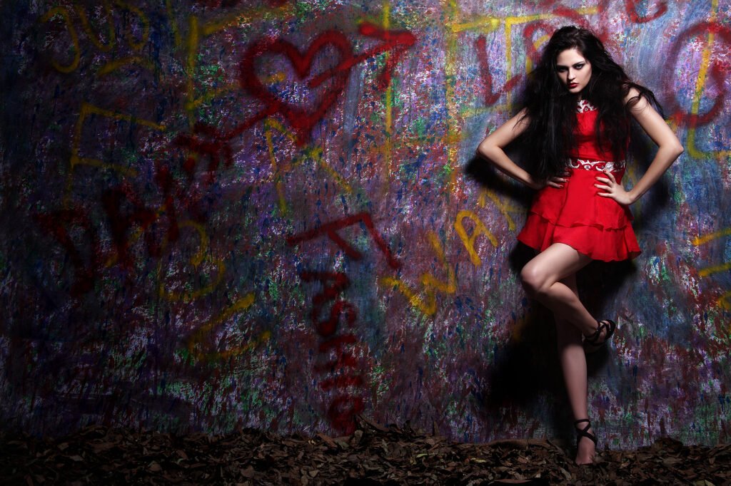 Fashion editorial photography Auckland of model posing in short red dress