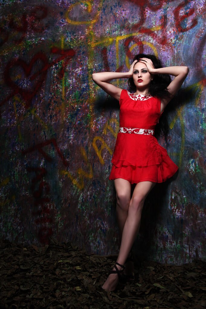 Fashion editorial photography Auckland of female model in red tiered dress