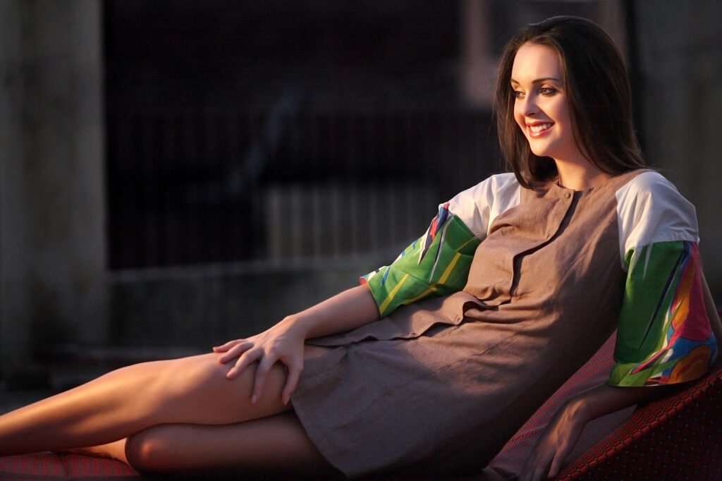 Outdoor fashion photography Auckland of smiling model in brown dress