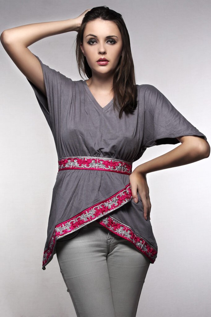 Commercial clothing photography Auckland of model in grey tunic with pink border