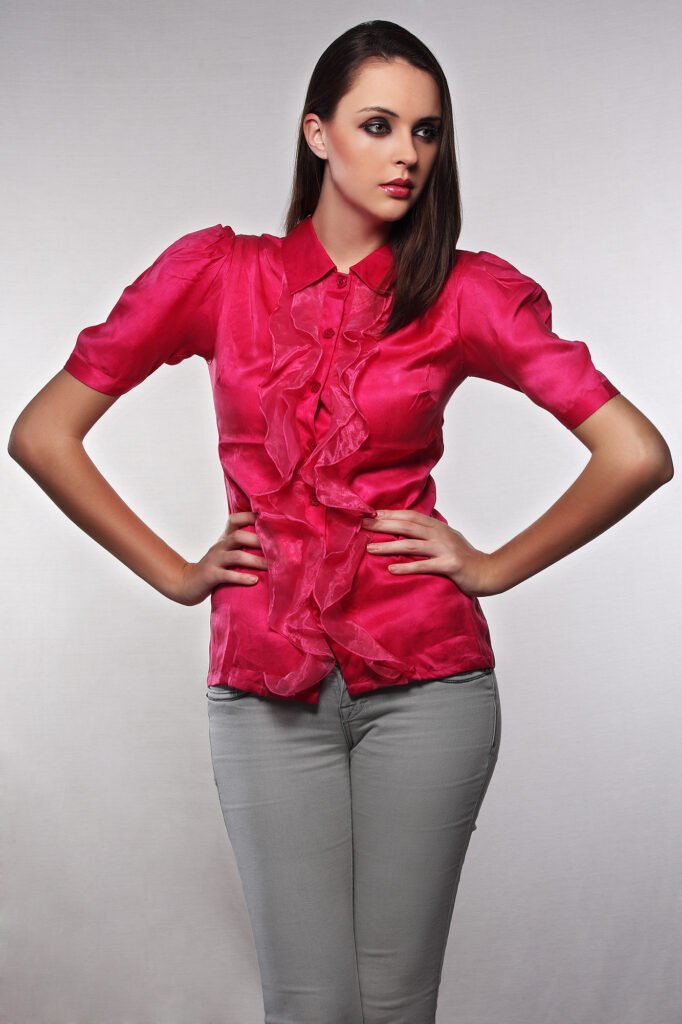 E-commerce apparel photography Auckland of model in pink ruffle shirt