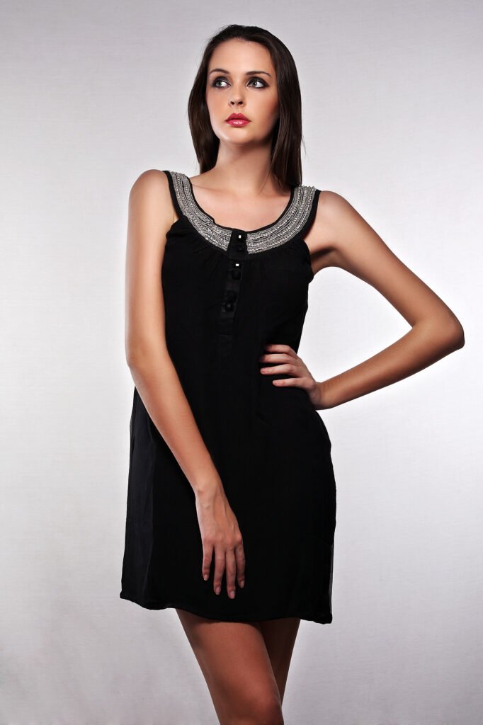 Apparel catalog photography Auckland of model in black dress