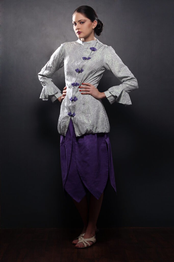 Fashion lookbook shoot Auckland of model in grey and purple dress