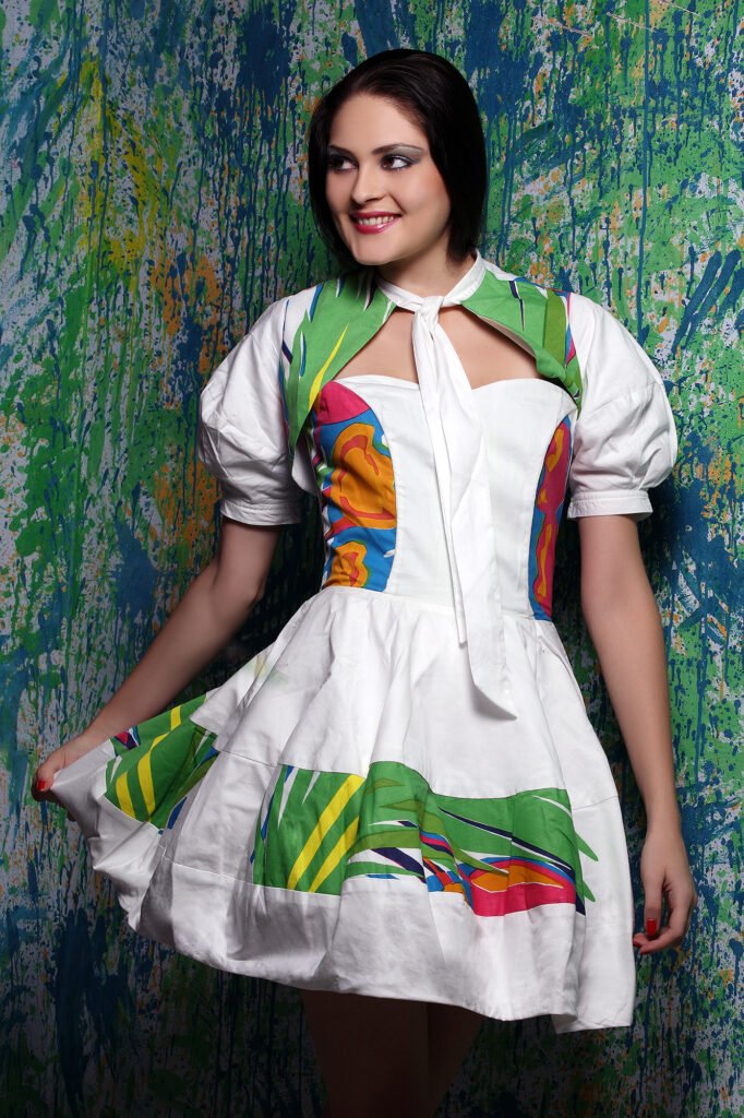 Studio clothing photography Auckland of smiling female model in white dress