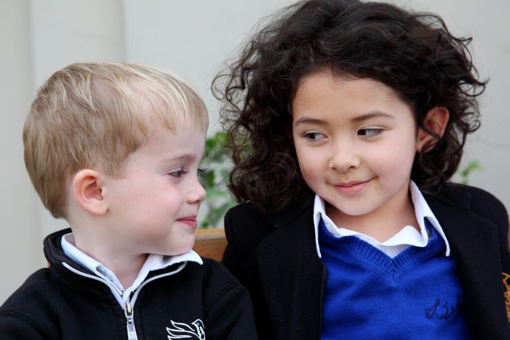 School branding photography Auckland of young school children smiling together