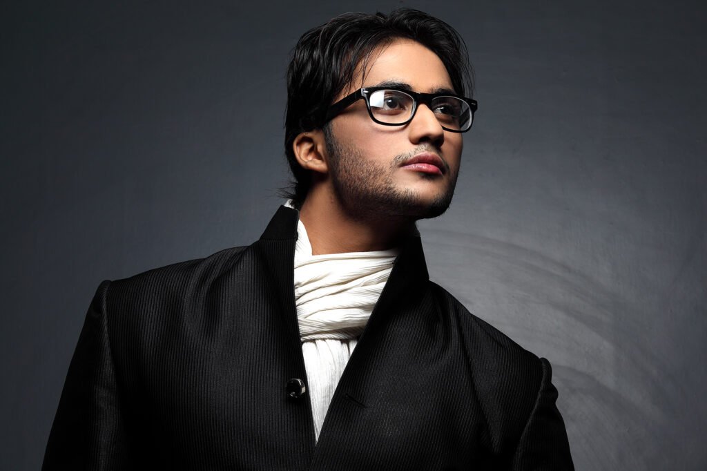 Cinematic male editorial portrait with dramatic studio lighting by Auckland portrait photographer Jassa