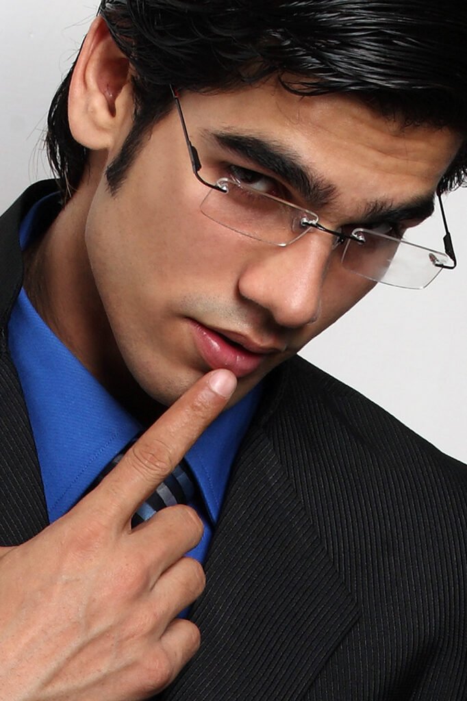 Professional male corporate headshot with glasses by Auckland portrait photographer Jassa Studio