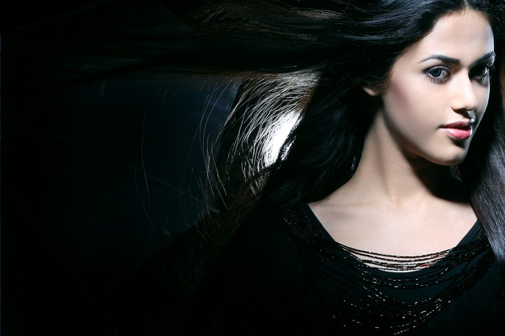 Female model portfolio photography in Auckland studio by Jassa Studio showing dramatic high contrast lighting headshot