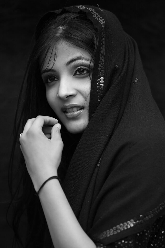 Fine art portrait photography session in Auckland studio by Jassa Studio showing classic black headscarf wardrobe and dramatic expressions