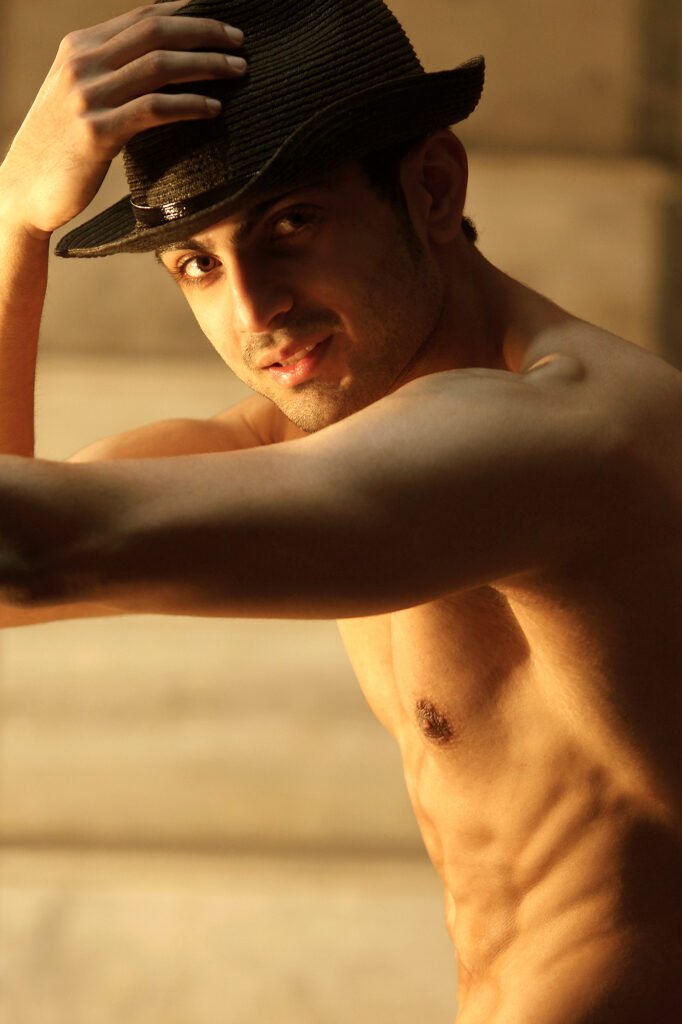 hirtless male model wearing a hat in a professional fitness and fashion portfolio shoot by Auckland photographer Jassa Studio